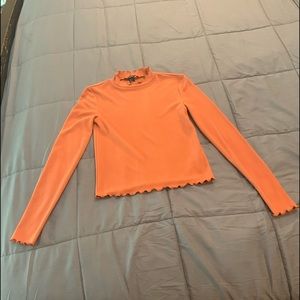 Orange turtleneck